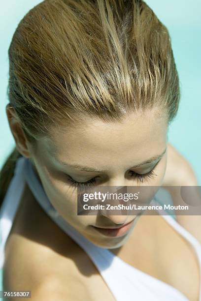 woman wearing halter bathing suit, head and shoulders, portrait, high angle view - slicked back hair stock pictures, royalty-free photos & images