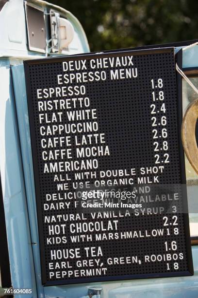 price list for hot drinks on a blue mobile coffee shop. - chalkboard menu stock pictures, royalty-free photos & images