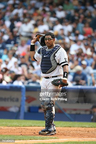 Jose Molina of the New York Yankees catches during the game against the Baltimore Orioles at the Yankee Stadium in the Bronx, New York on August 15,...