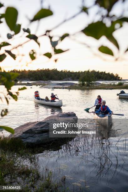 children canoeing - sweden archipelago stock pictures, royalty-free photos & images