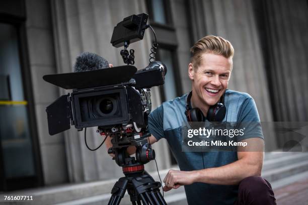 portrait of smiling camera operator - cinematographer imagens e fotografias de stock