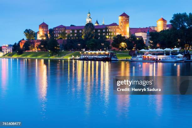 poland, lesser poland, krakow, wawel castle across vistula river - wawel castle stock pictures, royalty-free photos & images