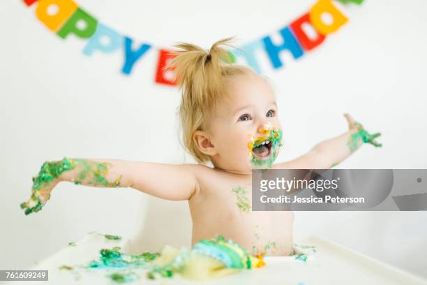 baby girl (12-17 months) celebrating first birthday - first birthday stock pictures, royalty-free photos & images