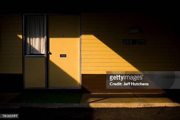 The setting sun makes a trapezoid on a motel room door at South of the Border Motel at South of the Border on July 21, 2006 in Dillon, South...
