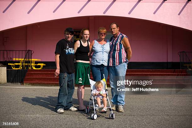 The Thogode family takes a break for ice cream cones on a New York to Florida haul at the ice cream shop at South of the Border on July 21, 2006 in...