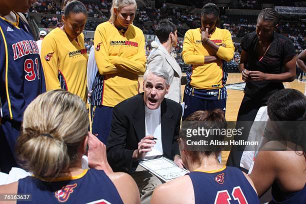 Head Coach Brian Winters of the Indiana Fever talks to his team during a timeout while playing the San Antonio Silver Stars at the AT&T Center on...