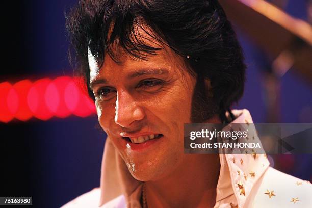 Shawn Klush of Franklin, Tennessee stands on stage after being declared winner in The Ultimate Elvis Tribute Artist Contest, 17 August 2007, in...