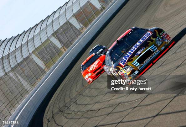Snickers Dark Car Ricky Rudd Ricky Rudd, driver of the Snickers Ford, drives ahead of Tony... News ...