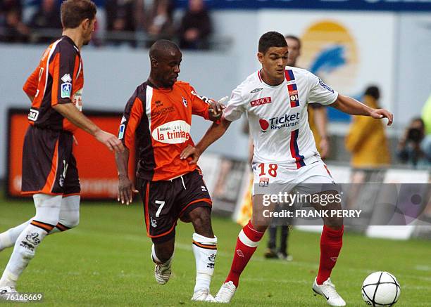 Lyon's midfielder Hatem Ben Arfa vies with Lorient's midfielder Oscar Ewolo , during their French L1 football match Lorient vs. Lyon, 18 August 2007,...