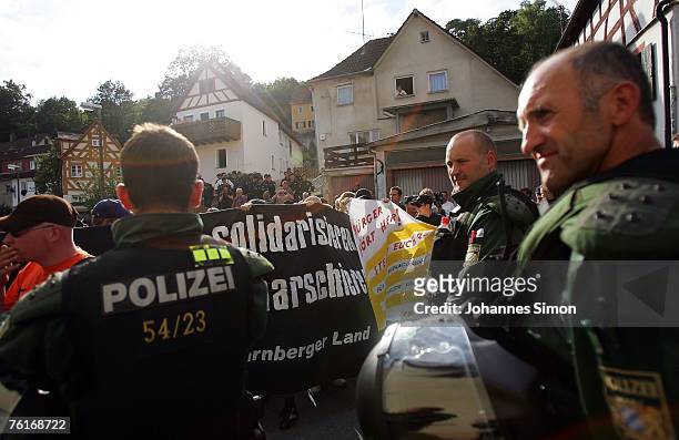 Neo-Nazis face riot police during a demonstration to commemorate the anniversary of the death of Rudolf Hess on August 18, 2007 in Graefenberg,...