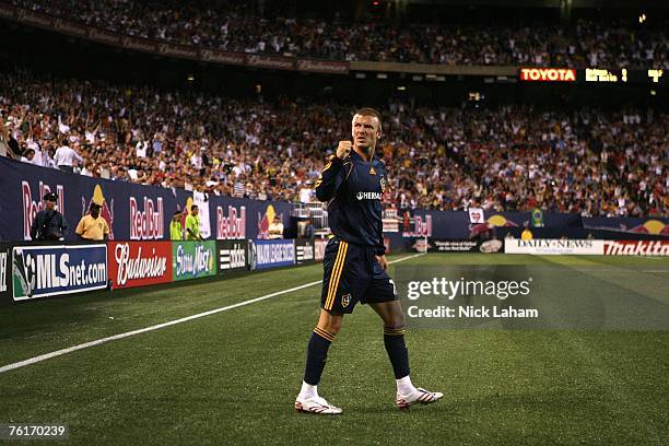 David Beckham of the Los Angeles Galaxy celebrates after a corner kick led to his teams third goal of the night against the New York Red Bulls at...