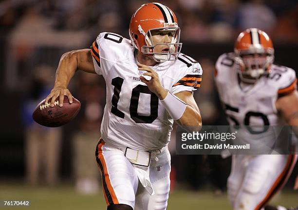 Quarterback Brady Quinn of the Cleveland Browns scrambles to throw a touchdown pass during the fourth quarter of a pre-season game against the...