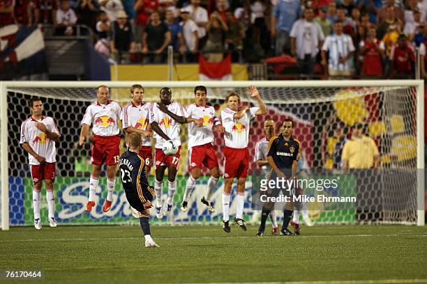 David Beckham of the Los Angeles Galaxy takes a free kick against the New York Red Bulls at Giants Stadium on August 18, 2007 in East Rutherford, New...