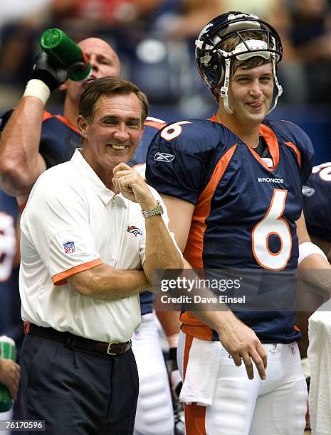 Denver Broncos head coach Mike Shanahan shares a laugh with quarterback Jay Cutler prior to a preseason game against the Dallas Cowboys at Texas...