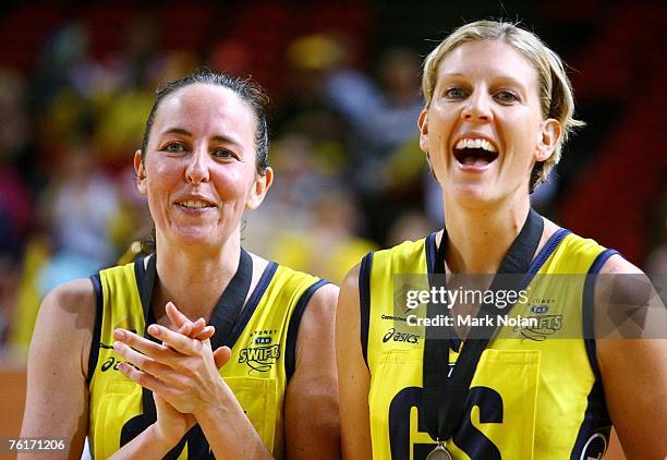 Liz Ellis and Catherine Cox of the Swifts laugh during the presentation ceremony after the Commonwealth Bank Trophy Final match between the Melbourne...