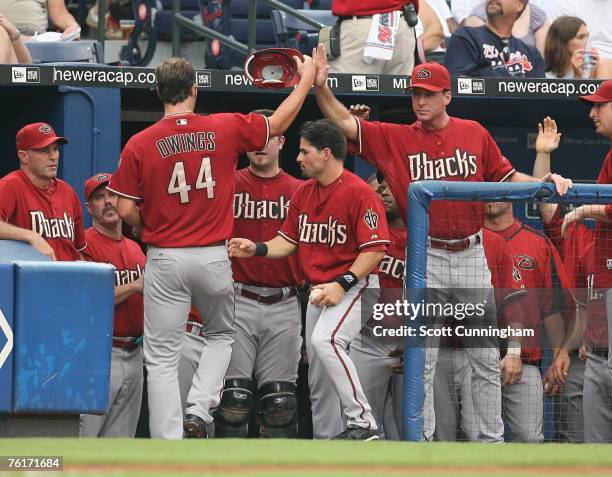 Micah Owings of the Arizona Diamondbacks is congratulated by Manager Bob Melvin after hitting a home run against the Atlanta Braves at Turner Field...