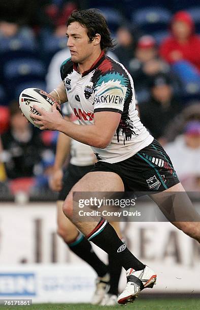 Trent Waterhouse of the Panthers runs the ball during the round 23 NRL match between the Newcastle Knights and the Penrith Panthers at...