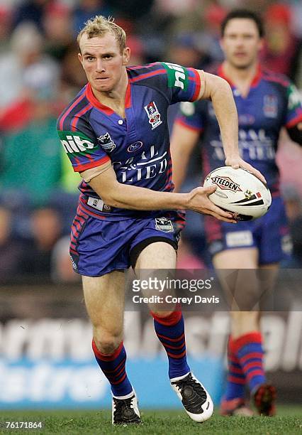 Luke Walsh of the Knights looks to pass during the round 23 NRL match between the Newcastle Knights and the Penrith Panthers at EnergyAustralia...