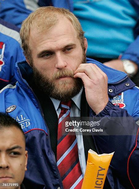 Kirk Reynoldson of the Knights watches the game from the stands during the round 23 NRL match between the Newcastle Knights and the Penrith Panthers...