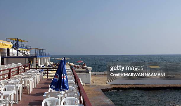 Lebanese citizens enjoy an afternoon at a virtually empty beach resort in Beirut, 19 June 2007. Breakfast at an upmarket hotel in the Lebanese...