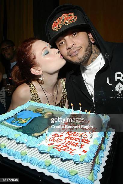 Vocalist Travis McCoy of Gym Class Heroes gets a birthday kiss from Penthouse Pet Justine Joli during his birthday party at Angels & Kings, August 18...