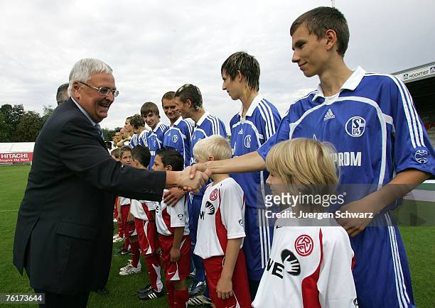 President of the German Football Association Theo Zwanziger shakes hands with the players of Schalke prior to the B Juniors Bundesliga match between...