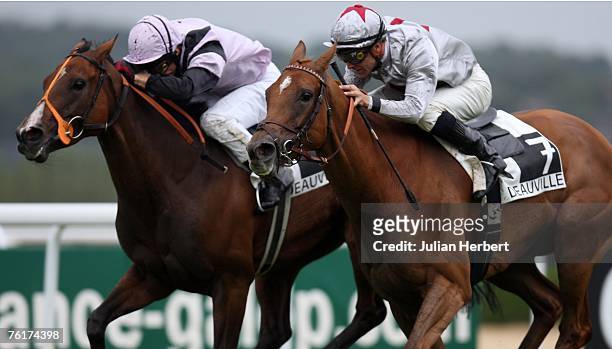 Thierry Thulliez ridden Satwa Queen gets the better of the Jimmy Fortune ridden Bahia Breeze to land The Prix Jean Romanet Race run at Deauville...