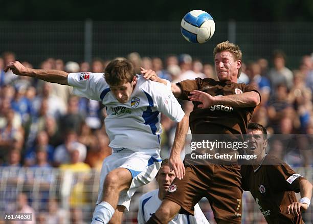 Ilja Kandelaki of Jena and Marvin Braun of St. Pauli battle for a header during the Second Bundesliga match between Carl Zeiss Jena and FC St. Pauli...