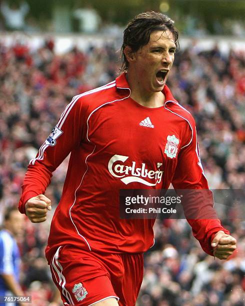 Fernando Torres of Liverpool celebrates scoring the opening goal during the Barclays Premier League match between Liverpool and Chelsea at Anfield on...