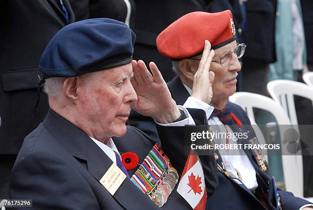 Canadian veterans John Edmondson and Joe Ryan salute the national anthem during the Remembrance Ceremony, 19 August 2007, at the Canadian War...