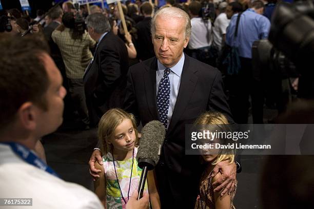 Senator Joe Biden talks to the media with his granddaughters Finnegan Biden and Maisy Biden in the spin room after the ABC News Democratic candidates...