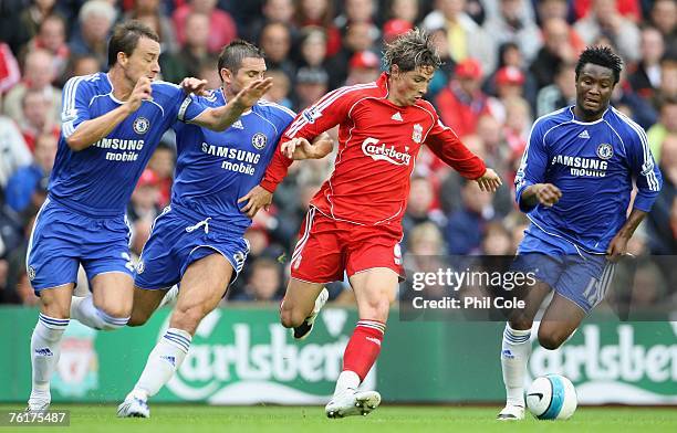 Fernando Torres of Liverpool is pressurised by John Terry , Frank Lampard and John Obi Mikel of Chelsea during the Barclays Premier League match...