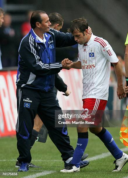 Huub Stevens , head coach of Hamburg, and Rafael van der Vaart of Hamburg are seen during the Bundesliga match between Hamburger SV and Bayer...