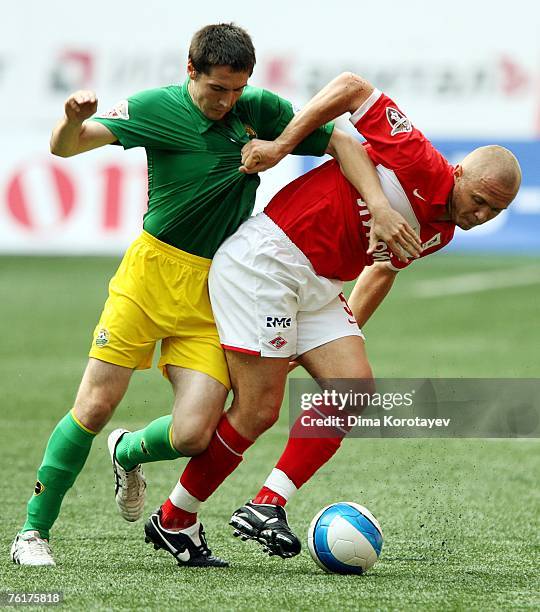 Santez Mozart of FC Spartak Moscow competes for the ball with Artur Tlisov of FC Kuban Krasnodar during the Russian Football League Championship...