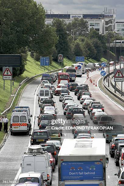 As a result of protests by The Camp For Climate Action, the traffic towards Heathrow Airport, Hounslow, London moves at a crawl because of Police...