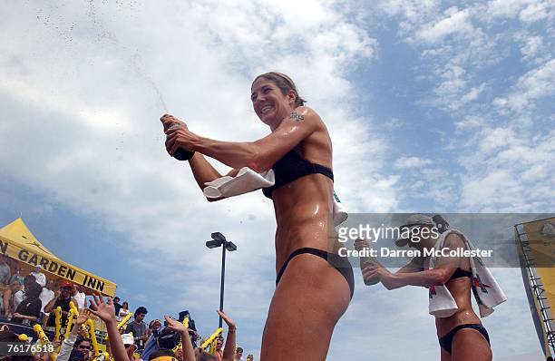 Nicole Branagh and Elaine Youngs celebrate following their victory at the AVP Bob's Store Boston Open at Marina Bay August 19, 2007 in Quincy,...