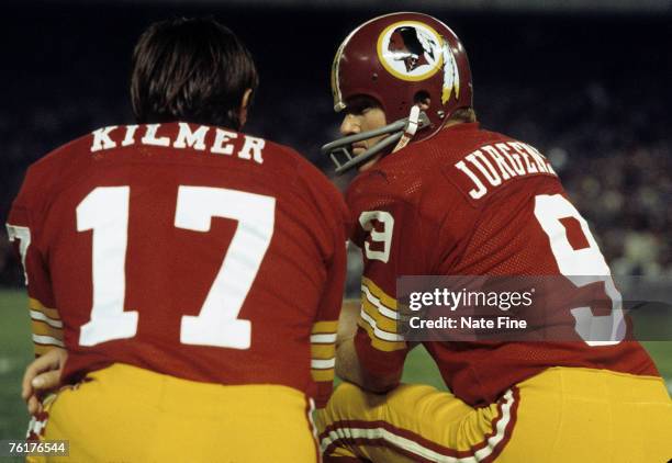 Hall of Fame quarterback Sonny Jurgensen of the Washington Redskins talks with backup Billy Kilmer during the Redskins 14-7 victory over the Dallas...