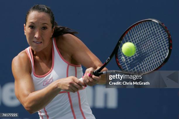 Jelena Jankovic of Serbia returns a shot against Justine Henin of Belgium during the Rogers Cup at the Rexall Center August 19, 2007 in Toronto,...