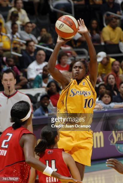 Sherill Baker of the Los Angeles Sparks shoots over Michelle Snow and Erin Grant of the Houston Comets on August 19, 2007 at Staples Center in Los...
