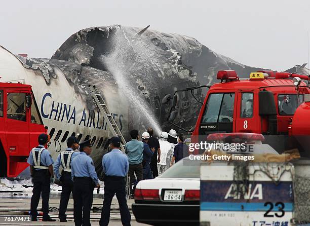 China Airlines aircraft Boeing 737 lies in ruins at Naha Airport August 20, 2007 in Okinawa, Japan. The aircraft's left engine exploded after landing...