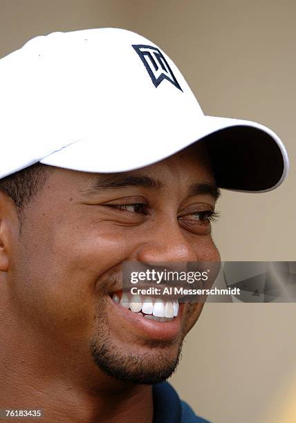 Tiger Woods is all smiles after a four-under-par round during the first day of the 2005 Funai Classic at World Disney World Resort on October 20,...