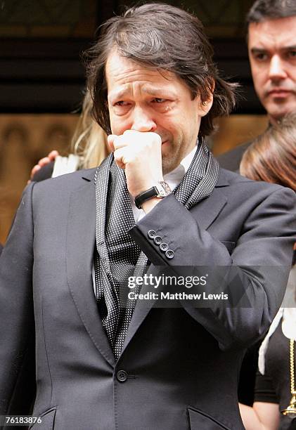 Designer Peter Saville leaves the funeral of Tony Wilson at the Hidden Gem Church on August 20, 2007 in Manchester, England. The former Factory...