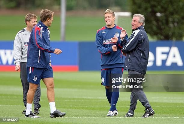 England's Phil Neville, Alan Smith and assistant manager Terry Venables share a joke during an England training session at the London Colney training...