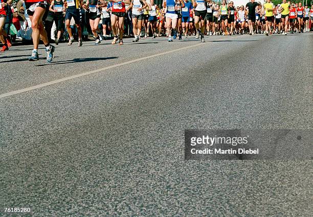 runners in a marathon - marathon stock-fotos und bilder