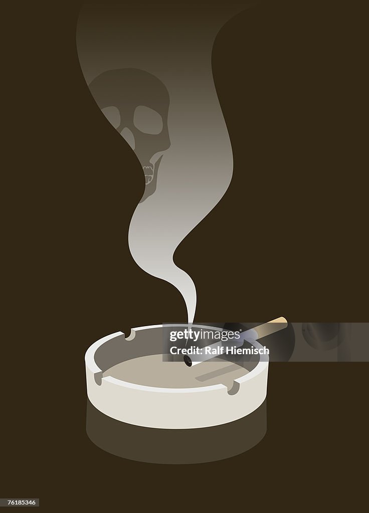 Cigarette burning in an ashtray