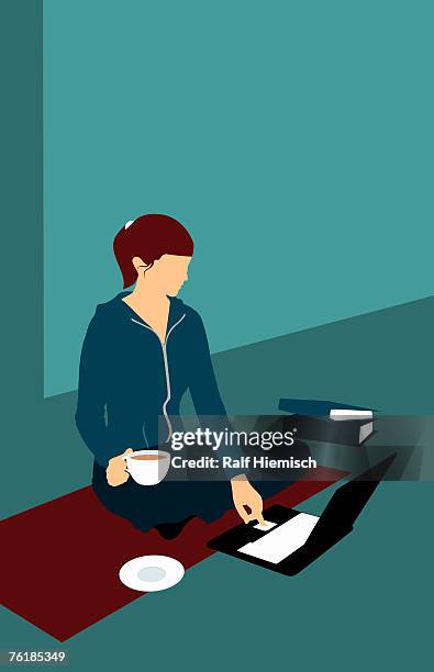 a woman sitting on the floor with a cup of tea and using a laptop - computer top view illustration stock illustrations