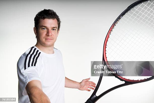 a tennis player - tennis racket stock-fotos und bilder