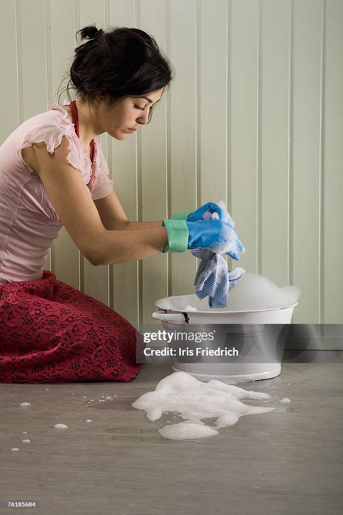 A woman cleaning the floor