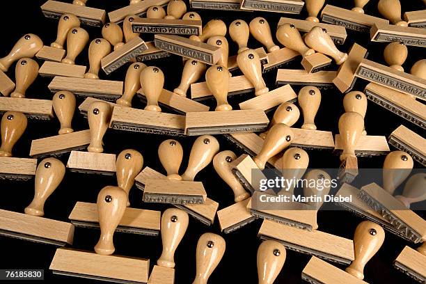 pile of rubber stamps - burocrazia foto e immagini stock