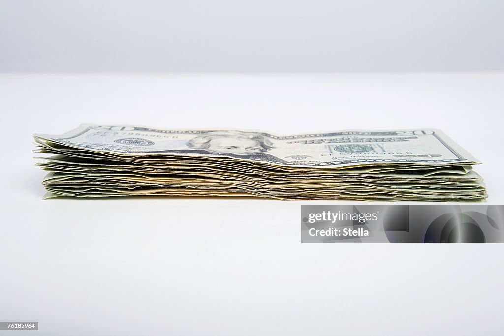 A stack of twenty dollar bills